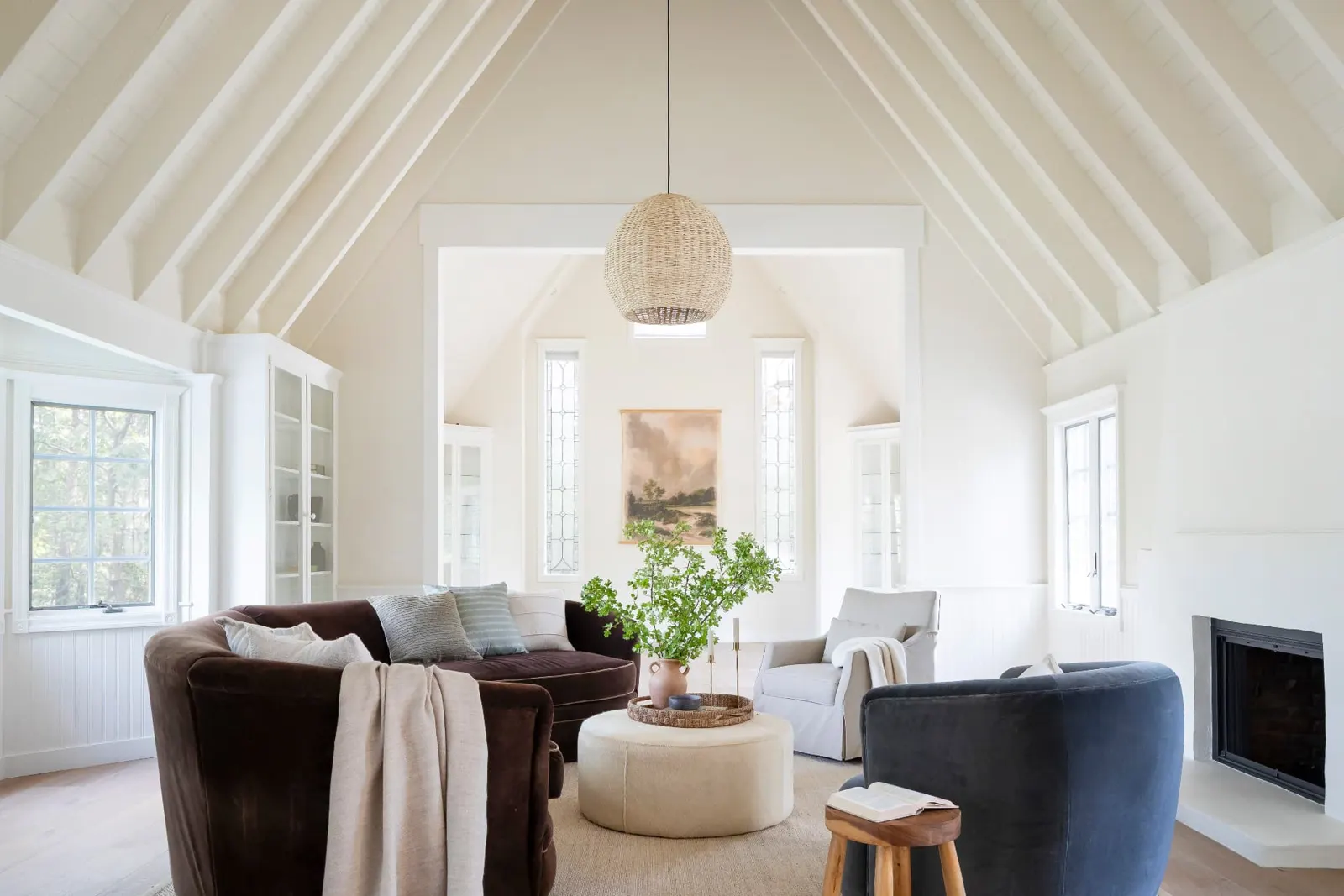 Sitting room under a vaulted, beamed ceiling